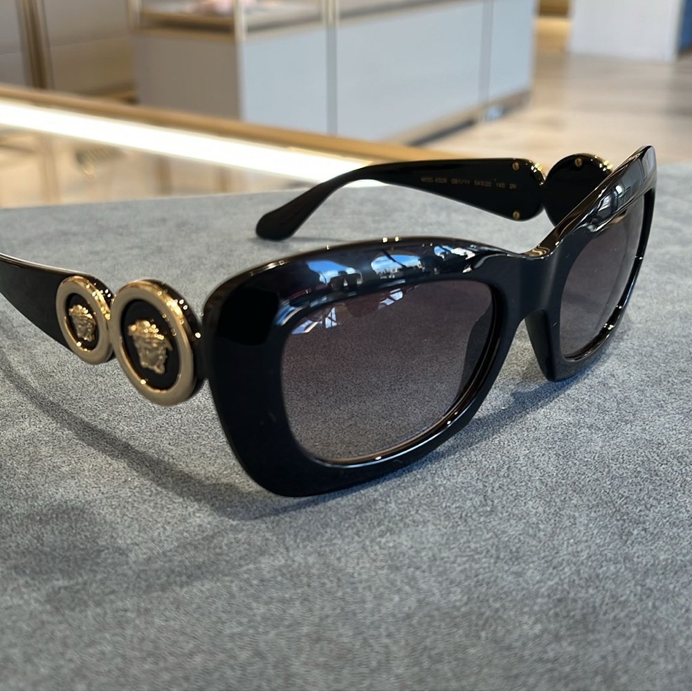 Versace Women's Sunglasses in Black with Gold Medallions